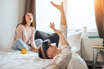 emotional man is being shocked with digital and physical world. unreal experience. close up photo, it is real , young man exploringvirtual reality and feeling scary