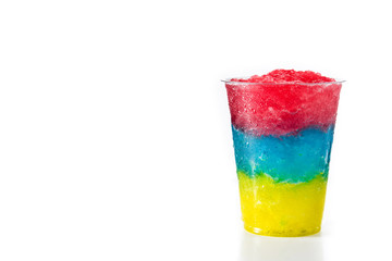 Colorful slushie of differents flavors with straw in plastic cup isolated on white background. Copy...