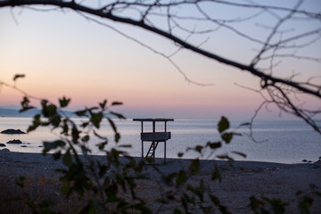 sunset seascape and coast guard tower