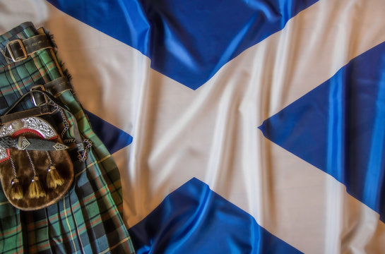 scottish kilt on a scotland flag background.
