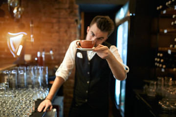 smart baristain elegant clothes, suit making and check smell of his hot coffee in cafe.blurred background