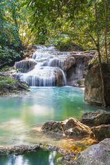 Fototapeta na wymiar Erawan waterfall in the rainforest