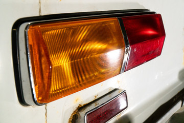 close-up of the rear lantern of an old white car