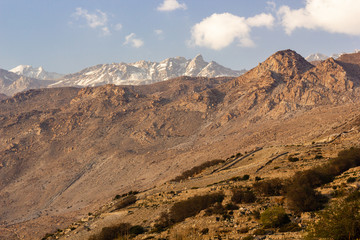 Fototapeta premium The dry, barren Himalayan mountains towering over the village of Nako in Kinnaur in Himachal Pradesh, India.
