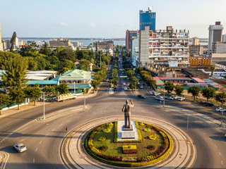 Samora Machel statue on Independence Square with the view of city downtown - obrazy, fototapety, plakaty