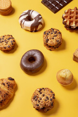 Sweet food pattern on a yellow paper background