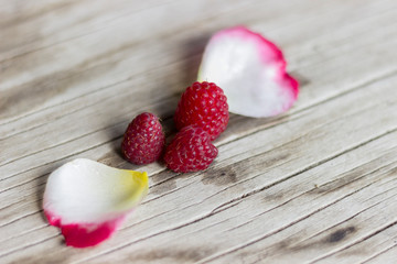 Raspberries on wooden background