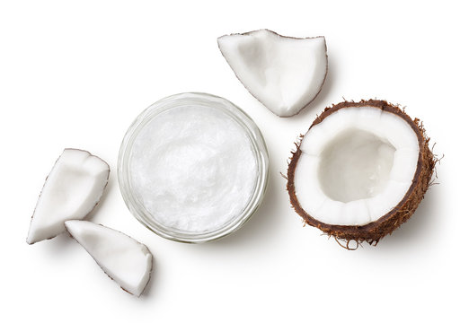 Jar of coconut oil and fresh coconut pieces