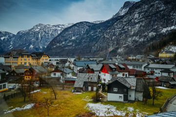 Fototapeta premium Famous Hallstatt mountain village and alpine lake top view landscape panorama, Austrian Alps, Austria. Landmark with traditional wooden houses on the lake. Unesco. Salzkammergut region. Travel concept