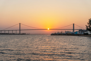 Fototapeta na wymiar Sunset with The Golden Bridge in Maputo, Mozambique