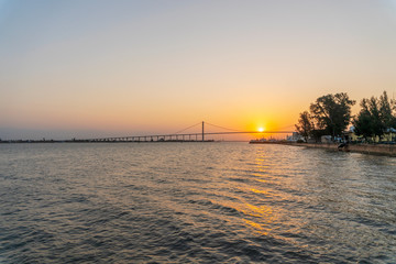 Fototapeta premium Sunset with The Golden Bridge in Maputo, Mozambique
