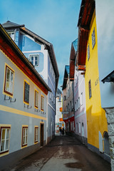 Fototapeta na wymiar Scenic view. The historic area of the mountain village Hallstatt with traditional colorful houses in Halshtati. Austria. Unesco. Salzkammergut region.