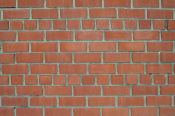 The texture of the brickwork of red brick. Structure, the outer part of the wall.