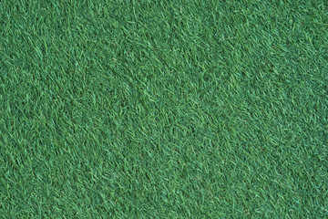 Close up surface of fake green grass for background or backdrop.