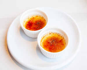 Traditional French creme brulee dessert with caramelized sugar on top