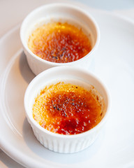 Traditional French creme brulee dessert with caramelized sugar on top