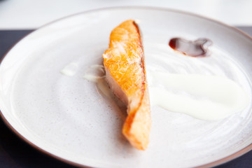 Grilled fresh salmon steak with sauce