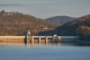 Fototapeta na wymiar Hydroelectric power plant dam at a reservoir near Brno