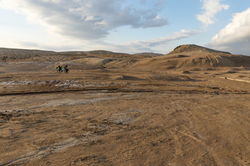Traveler's bicycle in the valley of mud volcanoes of Gobustan in Azerbaijan.