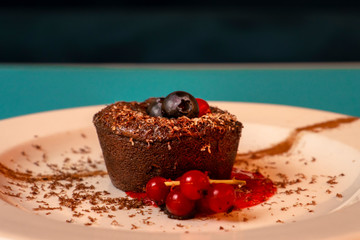 brownie on a plate with cranberries