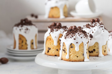 Traditional Easter bread with  white icing and chocolate eggs