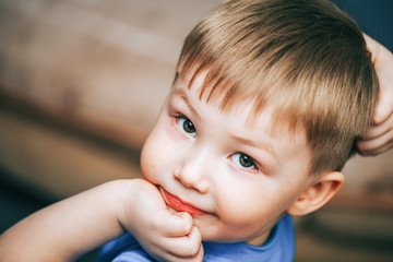 handsome blonde boy posing at home smiling, animator