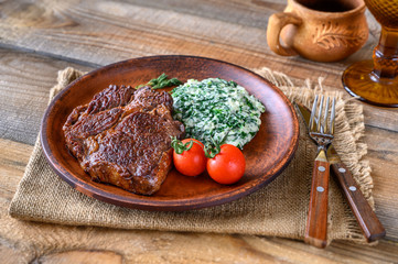 Beef steak with creamy spinach