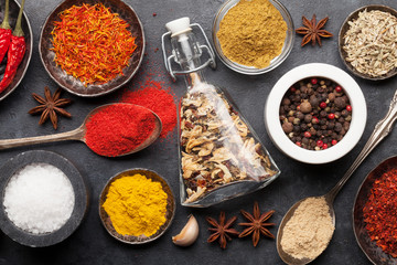 Fototapeta premium Various spices in bowls and spoons