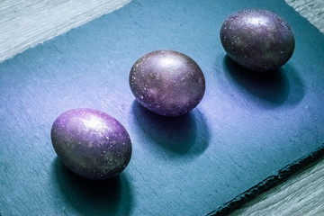 Slate cutting board with Easter cosmic space colored eggs