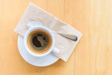 Top view of hot coffee with smoke on the table 