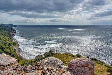 Baltic Sea and coast of Bornholm island seen from defensive walls of Hammershus castle, Bornholm...
