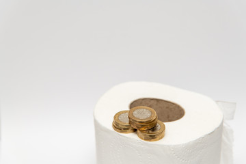Toilet Paper with British GBP Pound Coins Money
