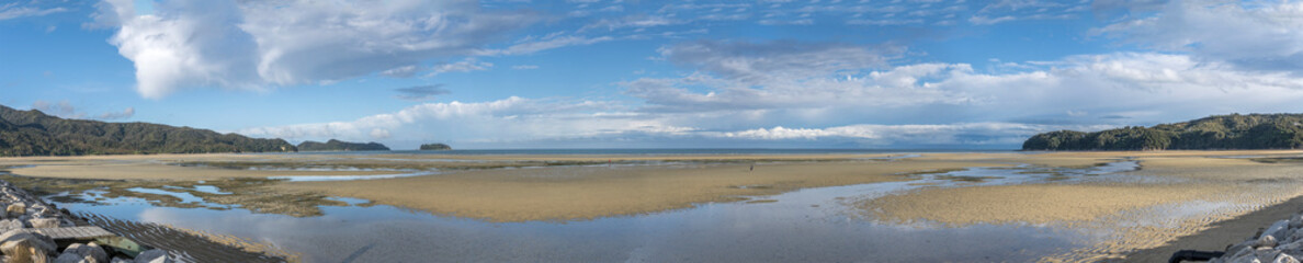 Fototapeta na wymiar low tide time on sand beach at Sandy Bay, Marahau, Nelson, New Zealand