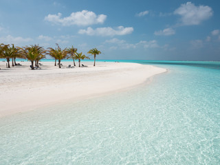 Fototapeta na wymiar Idyllic Beach on Maldives on Meeru Island with Palm Trees.