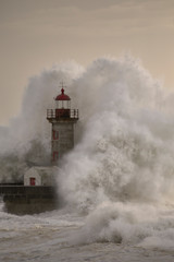 Fototapeta na wymiar Old lighthouse during storm