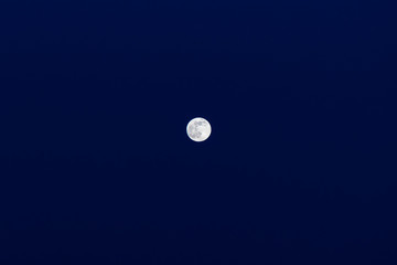 Night full moon on a blue sky. Little moon