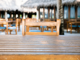 Top of Wood Table and Chair on Blur Background with Palm Tree, Tropical Cafe, Coffee Shop.