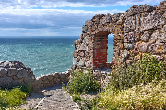 Ruins of Hammershus castle - Scandinavia's largest medieval fortification and the Baltic Sea.