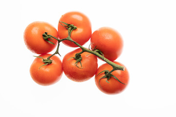 bunch of tomatoes isolated on white background