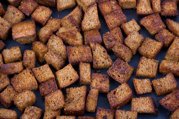 Fried square bread in a pan. Caesar Salad Bread