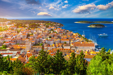 Naklejka premium View at amazing archipelago in front of town Hvar, Croatia. Harbor of old Adriatic island town Hvar. Popular touristic destination of Croatia. Amazing Hvar city on Hvar island, Croatia.
