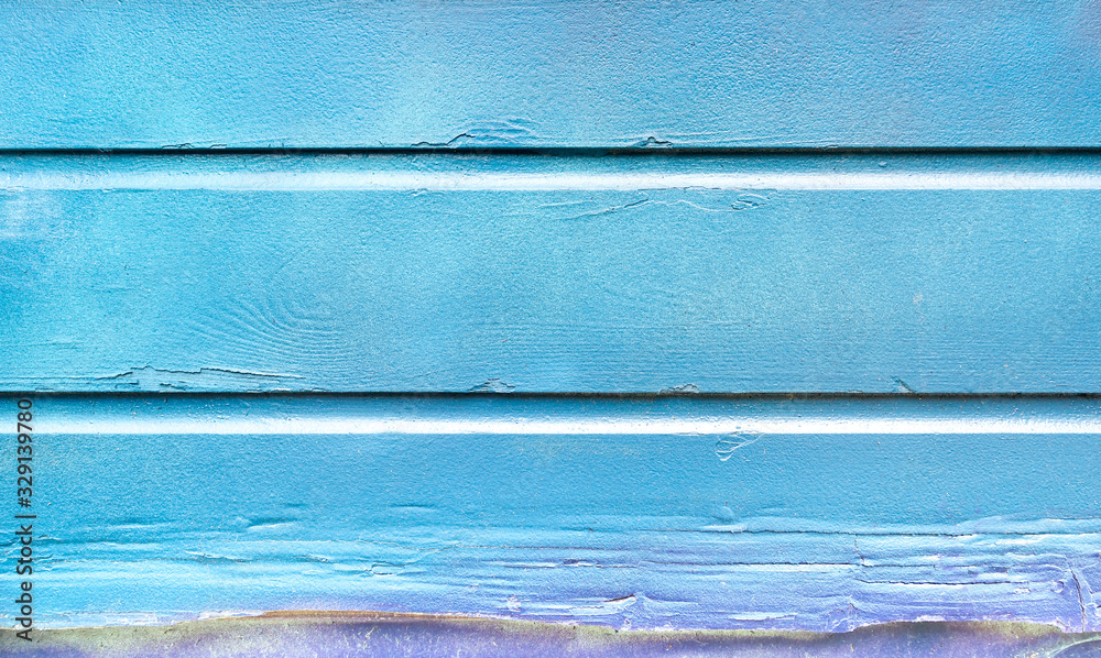 Fototapete blue painted background and alternative construction material - wooden textured panel in outer fence