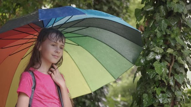 Happy child in the rain.