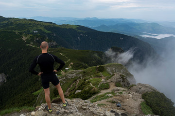 Person admiring the landscape after a mountain race