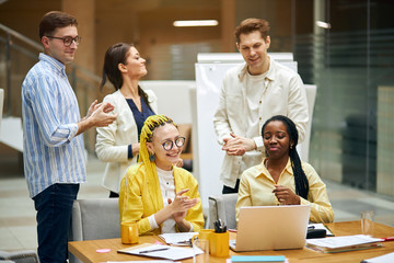 young successful mixed race team rejoising at bargain, close up photo. team has coped with problem