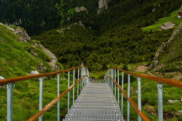 Stairs overlooking a mountain valley
