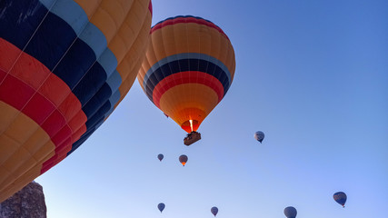 Hot air balloons preparing to fly at early morning in winter season in Cappadocia, Turkey