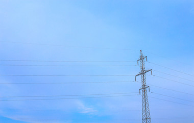 Old high voltage pylon against the sky
