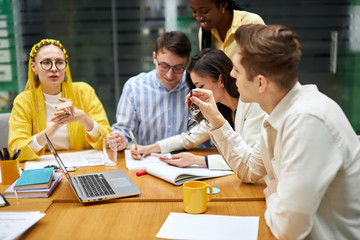 hardworking team trying to reach goals together, togetherness, close up photo. young people concentrated on working process