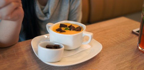Cheese cream soup on the table in the cafe